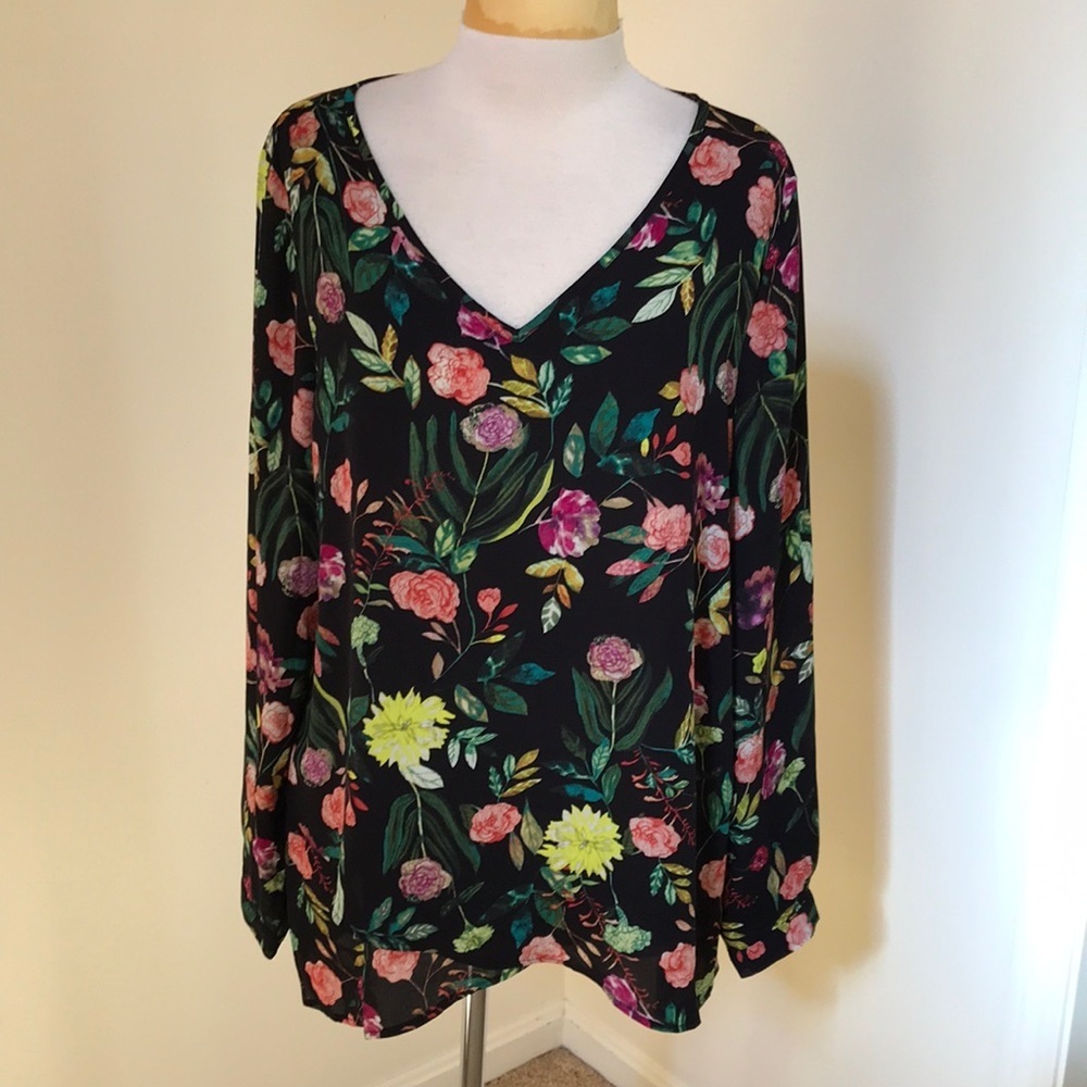 Chelsea and Theodore large black floral long sleeve asymmetrical top.
